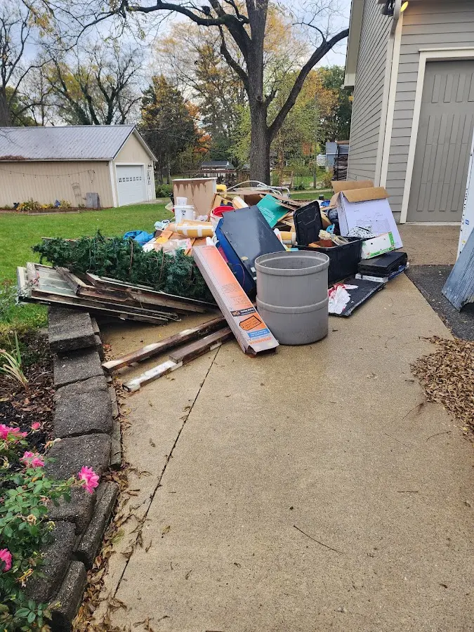 Dumpster being loaded with debris for 30 Yard Dumpster Rental in North Brunswick